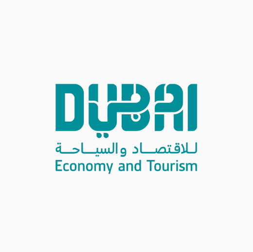 Teal Dubai Economy and Tourism logo combining stylized English and Arabic script on white.